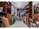 Spacious walk-in closet with custom shelves and racks, offering ample storage space at 1 Beach Se Dr # 2011, St Petersburg, FL 33701