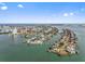 Gorgeous aerial view of a neighborhood surrounded by ocean and blue skies at 105 Island Way # 126, Clearwater Beach, FL 33767