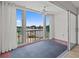 Enclosed balcony with water views and sliding glass doors that open to the outside at 105 Island Way # 126, Clearwater Beach, FL 33767