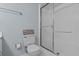Bathroom features a shower with sliding doors plus a standard-sized toilet at 105 Island Way # 126, Clearwater Beach, FL 33767