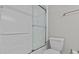 Bright bathroom with a white shower and toilet at 105 Island Way # 126, Clearwater Beach, FL 33767
