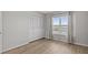 Bright bedroom features wood flooring, closet, and a large window at 105 Island Way # 126, Clearwater Beach, FL 33767