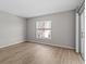 Bright bedroom features wood flooring, large window and sliding glass doors to the outside at 105 Island Way # 126, Clearwater Beach, FL 33767