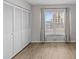 Bedroom featuring a large closet, wood floors and a window with an attractive view at 105 Island Way # 126, Clearwater Beach, FL 33767