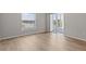 Bright bedroom features wood flooring, neutral paint, and a window that offers a beautiful view at 105 Island Way # 126, Clearwater Beach, FL 33767