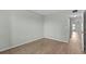 Empty bedroom with neutral paint and baseboard trim plus wood flooring at 105 Island Way # 126, Clearwater Beach, FL 33767