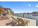 Dock with lounge chairs and shady seating area with views of the canal at 105 Island Way # 126, Clearwater Beach, FL 33767