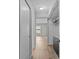 Hallway with hardwood floors leading to a bedroom at 105 Island Way # 126, Clearwater Beach, FL 33767