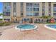 Community hot tub and pool offer a great place to relax and enjoy the warm weather at 105 Island Way # 126, Clearwater Beach, FL 33767