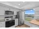 Well-lit kitchen features stainless steel appliances, and a scenic waterfront view at 105 Island Way # 126, Clearwater Beach, FL 33767