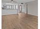 Open-concept living room featuring hardwood floors and a partial view of the kitchen at 105 Island Way # 126, Clearwater Beach, FL 33767