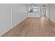 Living room with hardwood floors and a view of the kitchen at 105 Island Way # 126, Clearwater Beach, FL 33767