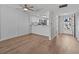 Inviting living area featuring wood floors, a kitchen with a breakfast bar, and ample natural light at 105 Island Way # 126, Clearwater Beach, FL 33767