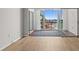 Living room featuring hardwood floors and sliding glass doors with water view at 105 Island Way # 126, Clearwater Beach, FL 33767
