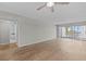Light filled living room boasting sleek wood floors and access to a private balcony at 105 Island Way # 126, Clearwater Beach, FL 33767