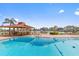 A sparkling pool offers a relaxing view of the waterway and neighborhood at 105 Island Way # 126, Clearwater Beach, FL 33767