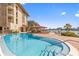 A refreshing swimming pool with views of the waterfront, offering a tranquil and inviting space for relaxation and recreation at 105 Island Way # 126, Clearwater Beach, FL 33767