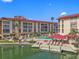 Waterfront condo with a community pool, hot tub, fishing dock, and covered patio at 105 Island Way # 126, Clearwater Beach, FL 33767