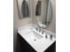 Bathroom featuring a sink, mirror, and modern faucet at 11541 Orleans Ln, Port Richey, FL 34668