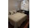 Cozy bedroom featuring a large window and neutral-toned bedding for a relaxing atmosphere at 11541 Orleans Ln, Port Richey, FL 34668