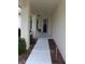 Covered walkway leading to the front door offering a welcoming approach to the residence at 11541 Orleans Ln, Port Richey, FL 34668