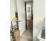 Hallway showing an open doorway with tiled floors at 11541 Orleans Ln, Port Richey, FL 34668