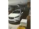 Garage interior with a white SUV parked inside at 11541 Orleans Ln, Port Richey, FL 34668