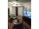 Inviting living room with a comfortable armchair and modern entertainment center at 11541 Orleans Ln, Port Richey, FL 34668