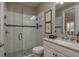 Modern bathroom features a glass shower with white subway tile and granite countertops at 11551 Callisia Dr, Odessa, FL 33556