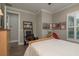 Comfortable bedroom with a desk, natural light, and neutral decor at 11551 Callisia Dr, Odessa, FL 33556