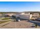 Expansive aerial view of community school building, showcasing its modern design and ample parking at 11551 Callisia Dr, Odessa, FL 33556