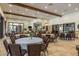 A well-lit clubhouse provides versatile seating with tables and chairs, perfect for social gatherings and community events at 11551 Callisia Dr, Odessa, FL 33556