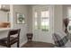 Bright foyer features a decorative glass door and sidelight, complemented by hardwood floors at 11551 Callisia Dr, Odessa, FL 33556