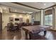 A recreational room provides a billiards table and comfortable seating, ideal for community enjoyment and relaxation at 11551 Callisia Dr, Odessa, FL 33556