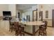 This lounge offers a bar area with sleek countertops and seating, ideal for gatherings and casual conversations at 11551 Callisia Dr, Odessa, FL 33556