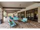 Elegant outdoor patio features comfortable seating, ceiling fans, and access to community pool at 11551 Callisia Dr, Odessa, FL 33556