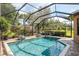 A screened-in pool area offers a relaxing retreat with water features and comfortable seating at 11551 Callisia Dr, Odessa, FL 33556