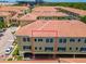 Scenic aerial view showing red tiled roofs, covered parking, and lush landscaping of condo building at 119 Beach Haven Ln, Tampa, FL 33609