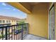 Balcony view showing the yellow apartment buildings and car park at 119 Beach Haven Ln, Tampa, FL 33609