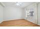 Bedroom featuring hardwood floors, a ceiling fan, and bright natural light at 119 Beach Haven Ln, Tampa, FL 33609