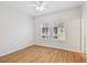 Bright bedroom with laminate flooring and natural light from two windows at 119 Beach Haven Ln, Tampa, FL 33609