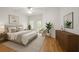 Bright bedroom with a ceiling fan, neutral decor, comfortable seating, and lots of natural light at 119 Beach Haven Ln, Tampa, FL 33609