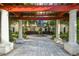 Charming courtyard featuring a fountain, lush landscaping, and inviting seating areas at 119 Beach Haven Ln, Tampa, FL 33609