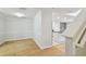 Well lit dining room with hardwood floors leading to the kitchen area at 119 Beach Haven Ln, Tampa, FL 33609