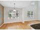 Dining room featuring natural light, hardwood floors, and modern pendant lighting at 119 Beach Haven Ln, Tampa, FL 33609