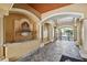Elegant entrance includes water feature, mailbox, and arched ceiling with tiled floors at 119 Beach Haven Ln, Tampa, FL 33609