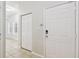 Hallway with tiled floors, large windows, bi-fold closet, and neutral paint offers a modern look at 119 Beach Haven Ln, Tampa, FL 33609