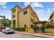 Well-maintained condo building exterior with tasteful landscaping, brick-paved street, and ample parking at 119 Beach Haven Ln, Tampa, FL 33609