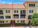 Beautiful townhome featuring a Mediterranean-style design and a red tile roof at 119 Beach Haven Ln, Tampa, FL 33609