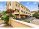 Rear exterior view showing multiple garage spaces and upper floors on sunny day at 119 Beach Haven Ln, Tampa, FL 33609